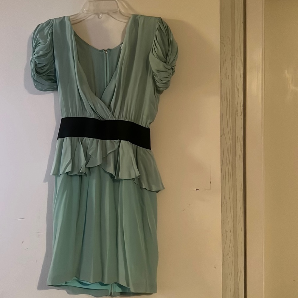 Peplum cocktail dress with shoulder pads